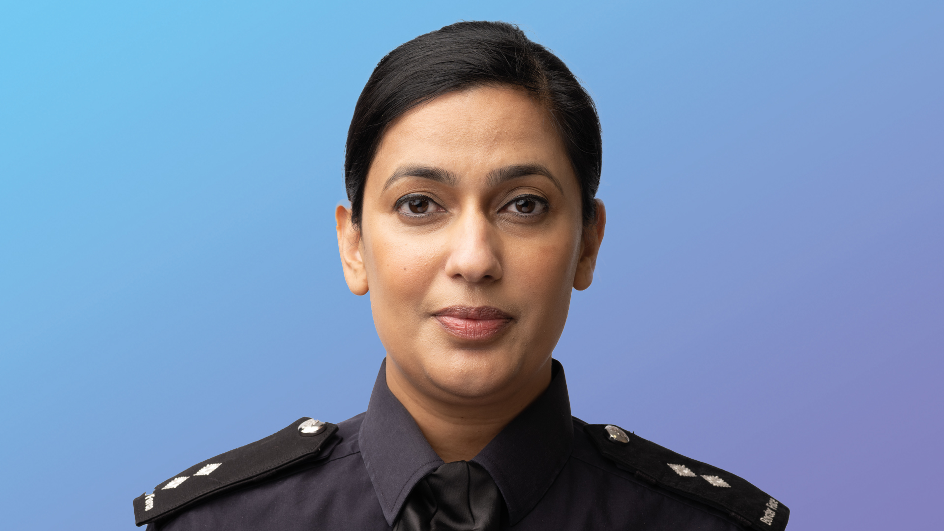 Border Force member of staff on a blue gradient background