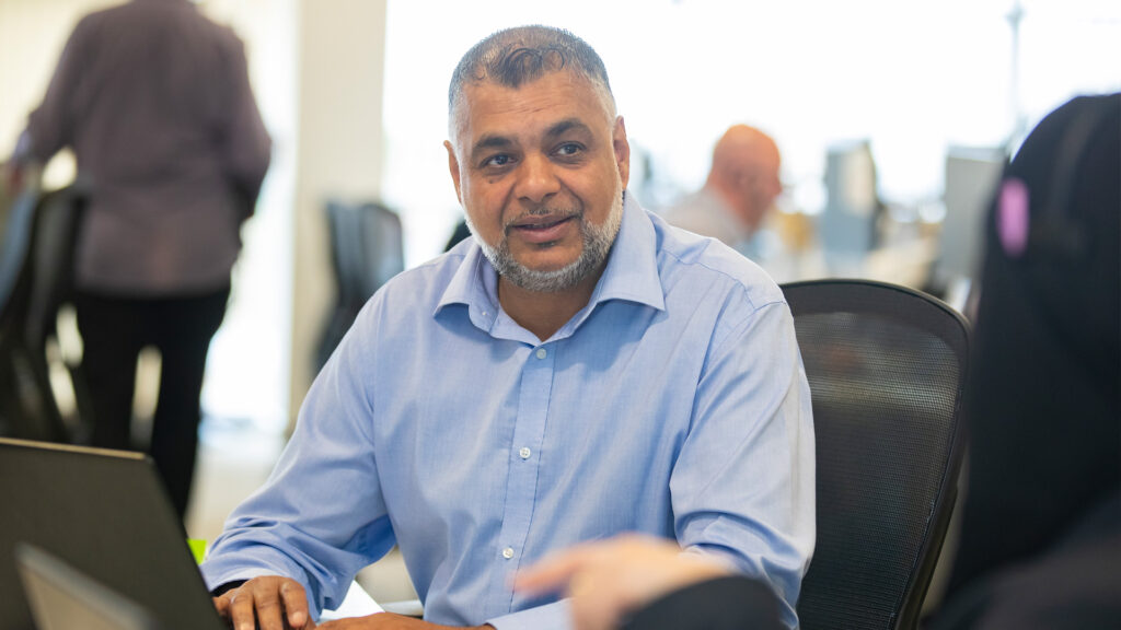 a member of staff with a laptop