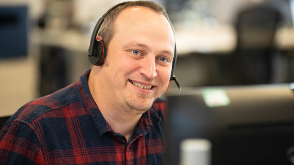 member of staff with a headset on