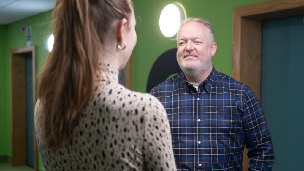 Two members of staff standing
